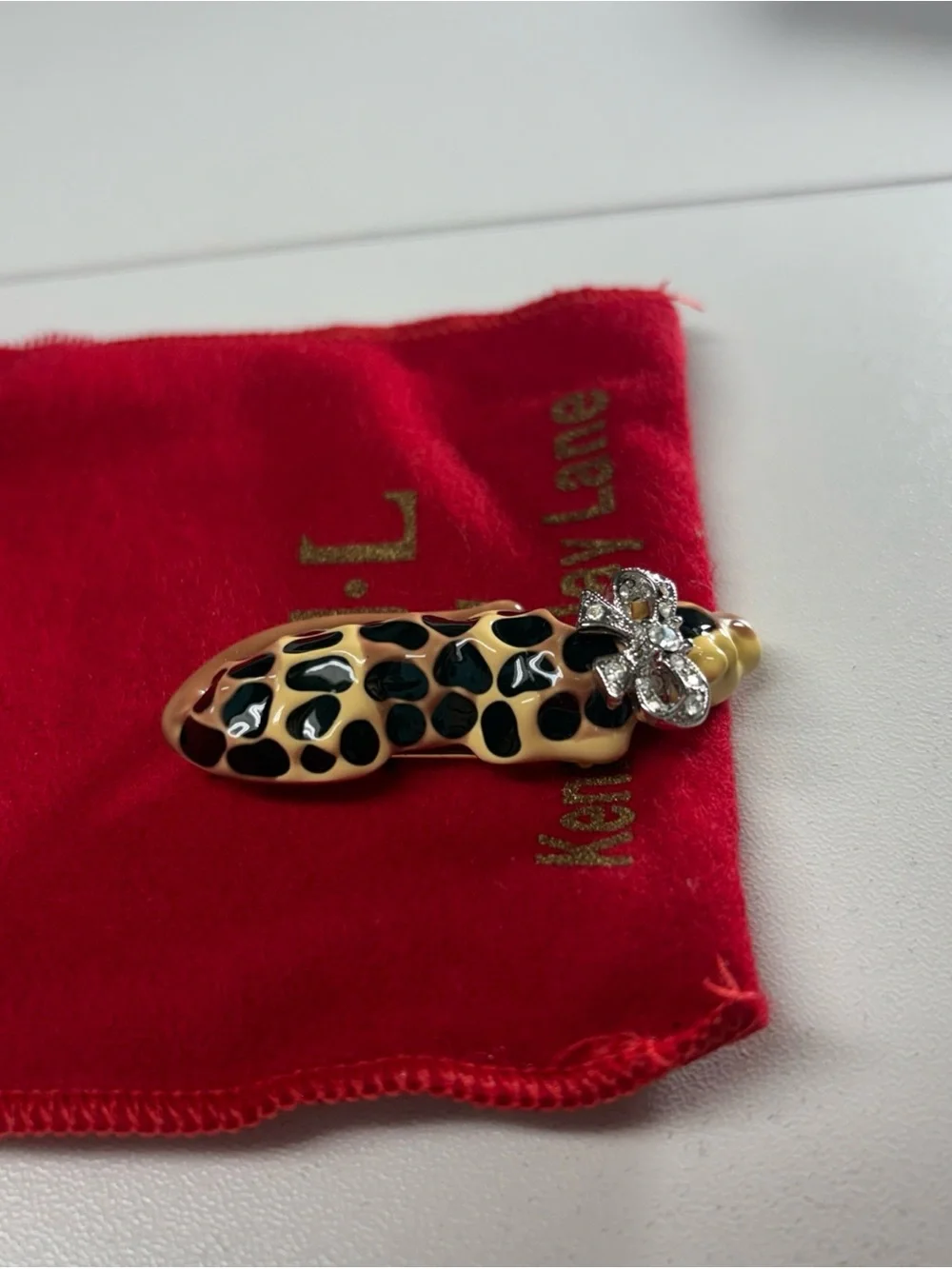 Kenneth Jay Lane Enamel Leopard Cat Brooch in Black and Tan with Rhinestone Bow